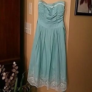 Green dress with  beige lace .